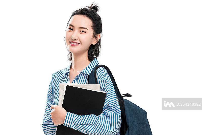 拿着书本的快乐女学生照片摄影图片